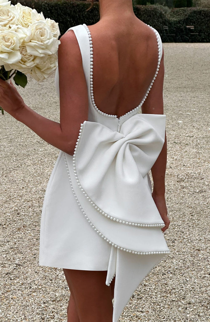 Hollis - Elegant Pearl Bow Mini Dress