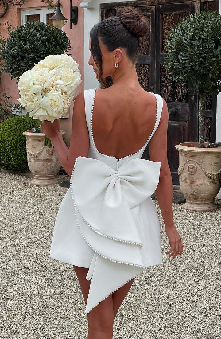 Hollis - Elegant Pearl Bow Mini Dress